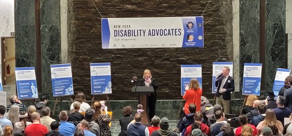 Speaker from Disability Advocates addressing a crowd